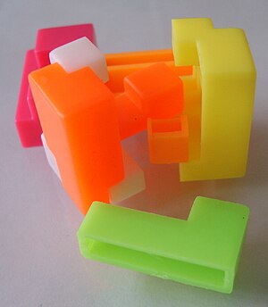 A puzzle undone, which forms a cube.