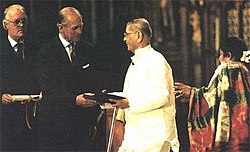 Pandurang Shastri Athavale receiving the Templeton Prize for Progress in Religion, from Prince Philip at a public ceremony held in Westminster Abbey, 6 May 1997 Pandurang Shastri Athavale-Templeton Prize 1997.jpg