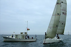 An ID35 near the race committee boat, Humber Bay, Toronto, Ontario