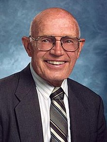 Donald E. Bently, an older business man in a suit, smiling
