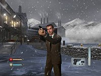 Мужчина в костюме держит пистолет. Идет снег, на заднем плане - завод. В нижних углах можно увидеть значки, обозначающие боеприпасы и здоровье игрока.