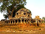 Large Chandella tank on the embankment on which stands a large ruined temple of the earliest Chandella type