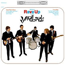 Color photo of the Yardbirds posed in a mock performance, l to r: Chris Dreja, Paul Samwell-Smith, Jim McCarty, Keith Relf, Jeff Beck