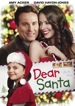 Изображение мужчины, женщины и ребенка и почтовое письмо со словами «Дорогой Санта».