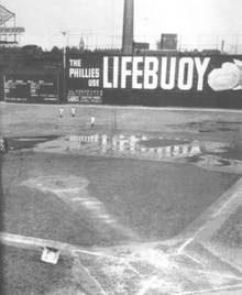 Baker Bowl's right field wall in 1937 after the metal screen was added to extend the total height to 60 feet (18 m) Baker bowl right field.png