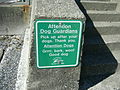 Sign reminding dogs how to behave.