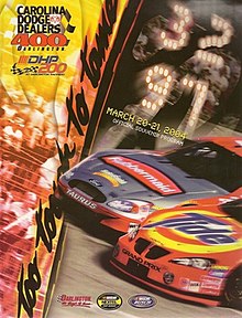 The 2004 Carolina Dodge Dealers 400 program cover, featuring the finish of 2003 Carolina Dodge Dealers 400 between Ricky Craven and Kurt Busch.