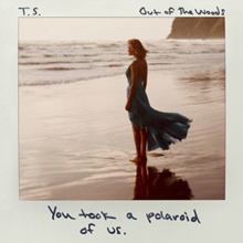Cover artwork of "Out of the Woods" by Taylor Swift showing Swift standing on a beach