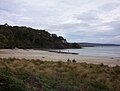 Looking from the camping location, Cloudy Bay is a quiet and peaceful beach with calm waters and slowly levelling sands.