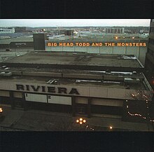 A photo of a large industrial building with a sign that states Riviera
