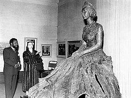 Ben Enwonwu with Queen Elizabeth II and his bronze statue of her.jpg