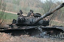 Destroyed Lion of Babylon tank on Highway 9 outside Najaf during US invasion in 2003 DestroyedT-72outsidenajaf.jpg