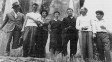 Certain founding members of the Situationist International in 1957. From left to right: Giuseppe Pinot-Gallizio, Piero Simondo, Elena Verrone, Michele Bernstein, Guy Debord, Asger Jorn, and Walter Olmo. Situationist International 1957.png
