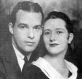 Young man and young woman, white, in studio portrait