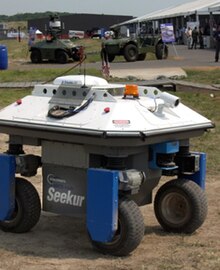 The Seekur and MDARS robots demonstrate their autonomous navigation and security capabilities at an airbase. SmSeekurMDARS.jpg