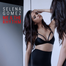 Gomez looking at her reflection in a mirror. To her left, her name and the song's title can be seen.