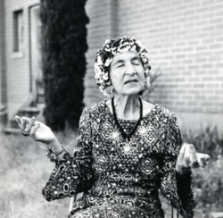 Black and white photograph of Helen Adam, seated