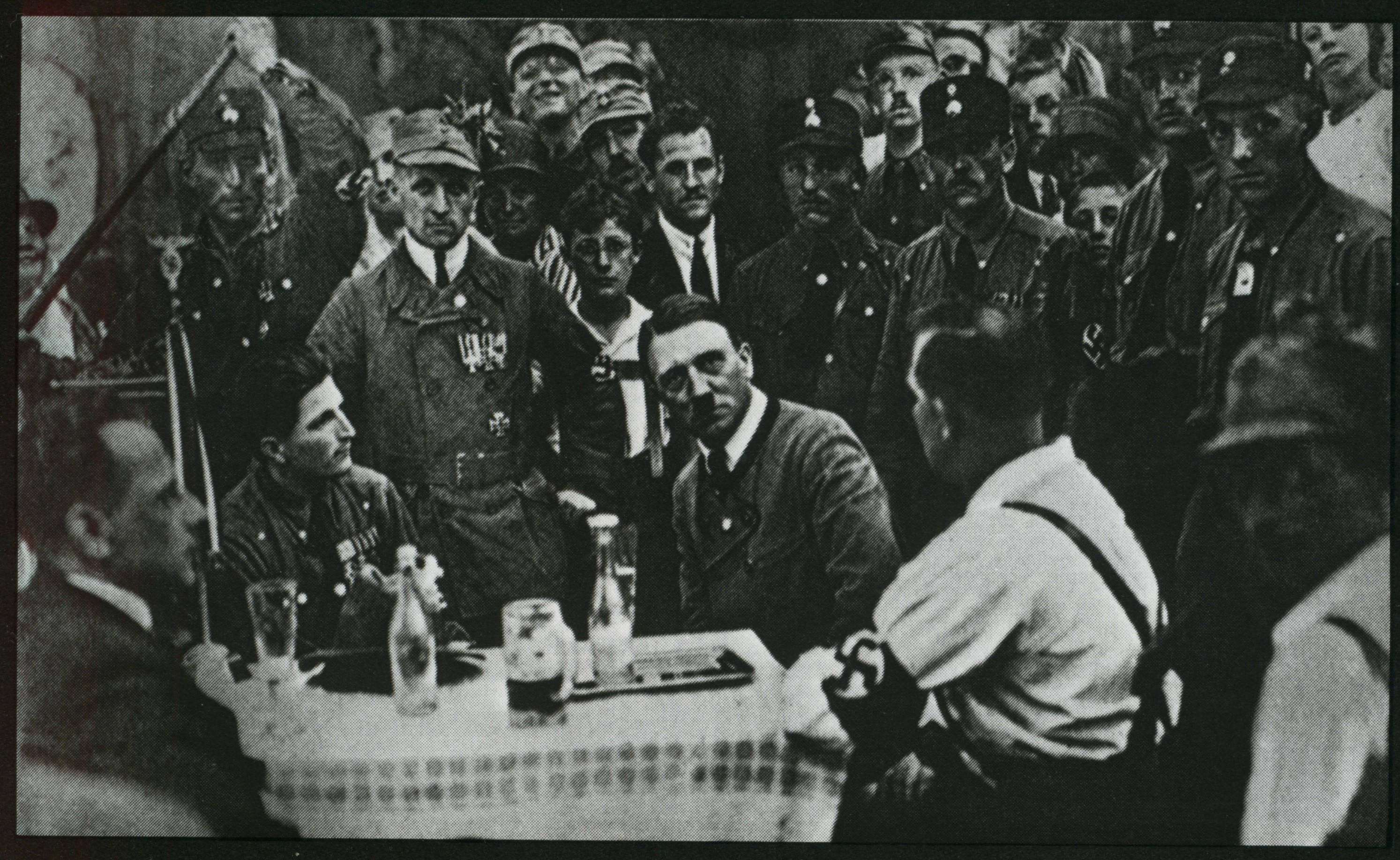 Meeting of the members of the NSDAP in Munich. In the center sits Adolf Hitler.