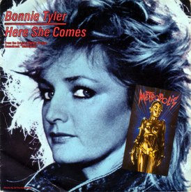Обложка сингла Бонни Тайлер «Here She Comes» (1984)