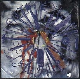 Обложка альбома Carcass «Tools of the Trade» (1992)