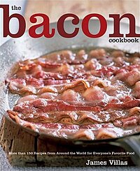 Picture of bacon frying in a pan.