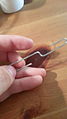 2. Bend the paper clip into straight length