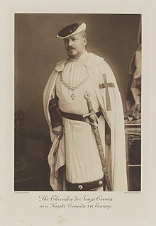 Black-and-white photograph of a standing man dressed as a medieval Knight Templar