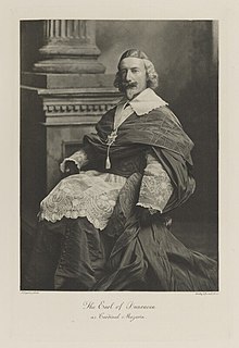 Black-and-white photograph of a seated man richly dressed in an historical costume as a cardinal in the Catholic Church