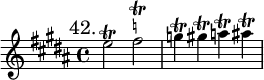 { \mark "42." \key b \major \time 4/4 \relative e'' {
  e2\trill fis^\markup \teeny \natural \trill | g4\trill gis\trill a\trill ais\trill } }