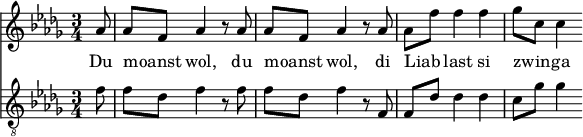 
<<
  \relative aes' {
    \key des \major
    \time 3/4
    \partial 8
    aes8 | aes f aes4 r8 aes8 | aes f aes4 r8 aes8 | aes f' f4 f | ges8 c, c4
  }
  \addlyrics {
    Du moanst _ wol, du moanst _ wol, di Liab _ last si zwin _ -- ga
  }
  \relative f' {
    \key des \major
    \clef "G_8"
    \time 3/4
    \partial 8
    f8 | f des f4 r8 f8 | f des f4 r8 f,8 | f des' des4 des | c8 ges' ges4
  }
>>
