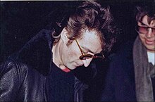 John Lennon signs an autograph..jpg