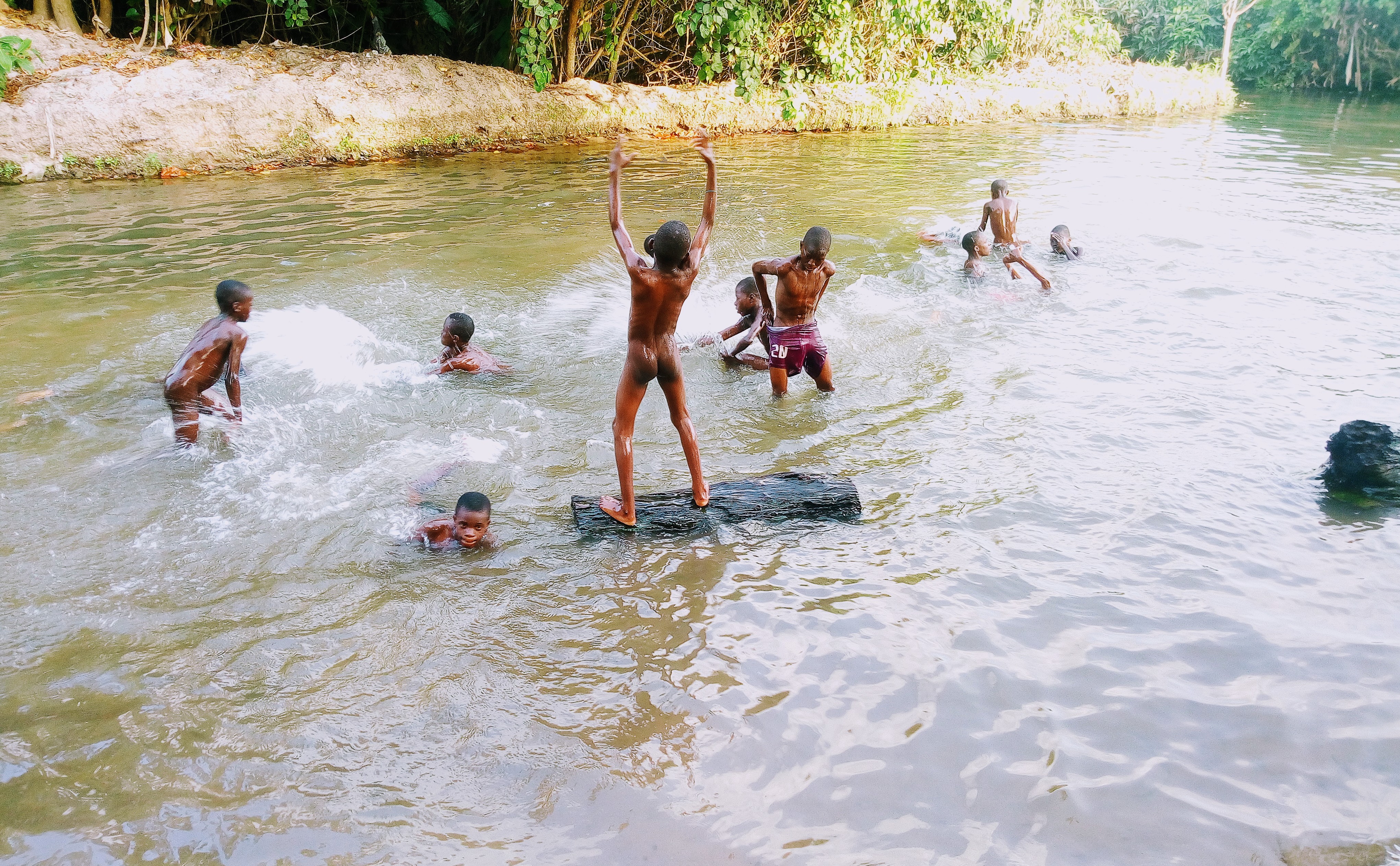 kids bathing in river