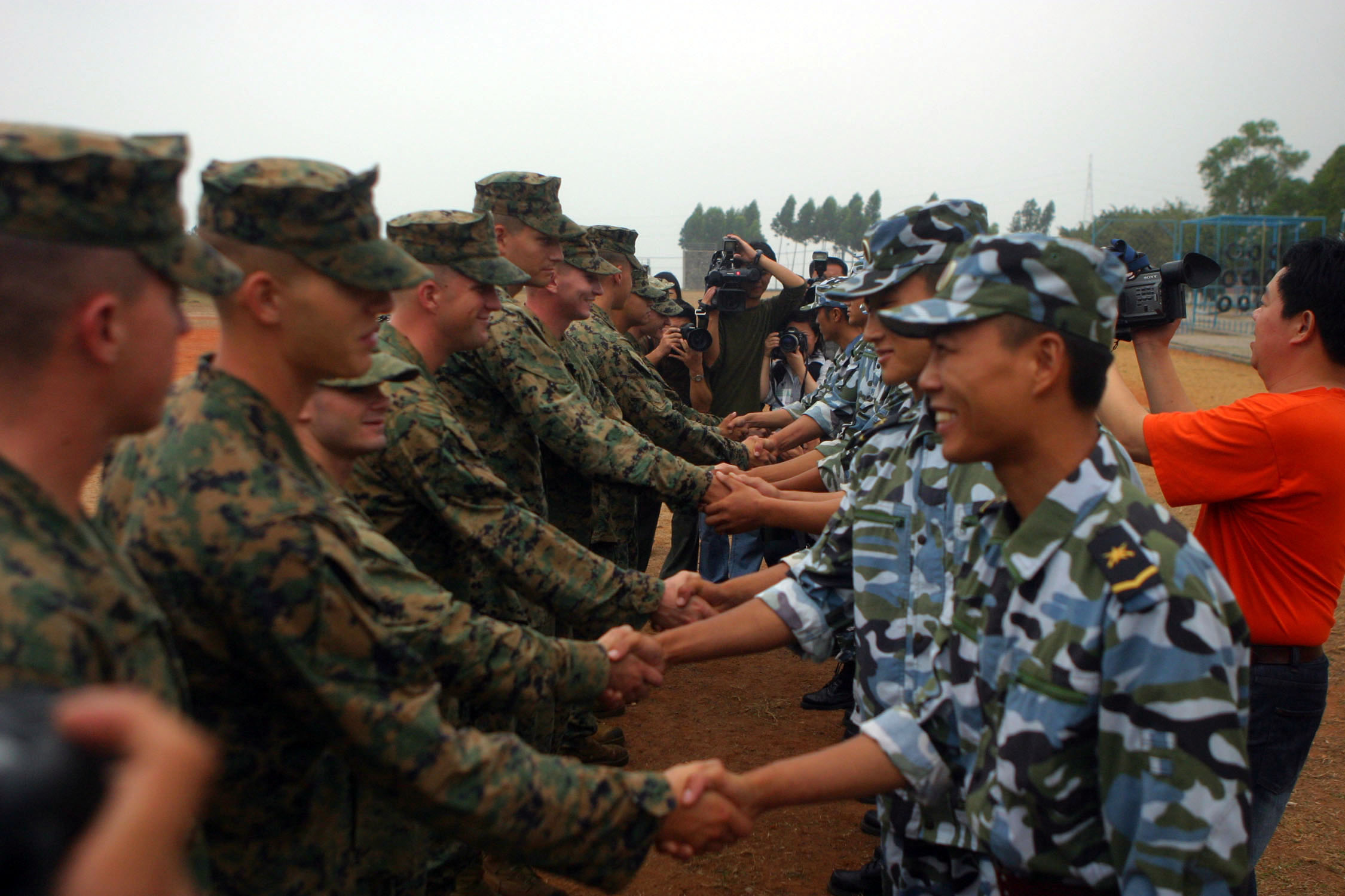 US_Navy_061117-M-9827H-045_Marines_and_People%27s_Liberation_Army_%28Navy%29_%28PLA%28N%29%29_1st_Marine_Brigade_Marines_shake_hands_at_the_start_of_%22Marine_Day%22_1st_Marine_Brigade%27s_obstacle_course.jpg