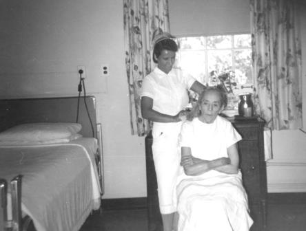 File:Nurse combing patients hair La Junta CO (24846531862).jpg