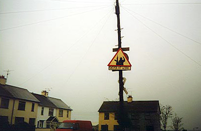 A "Sniper at Work" sign in Crossmaglen. The IRA's South Armagh Brigade killed seven members of the security forces in single-shot sniper attacks in 1993.[164]
