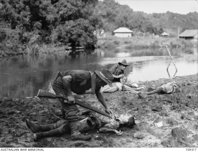 File:Australian troops inspecting the bodies of dead Japanese soldiers.JPG