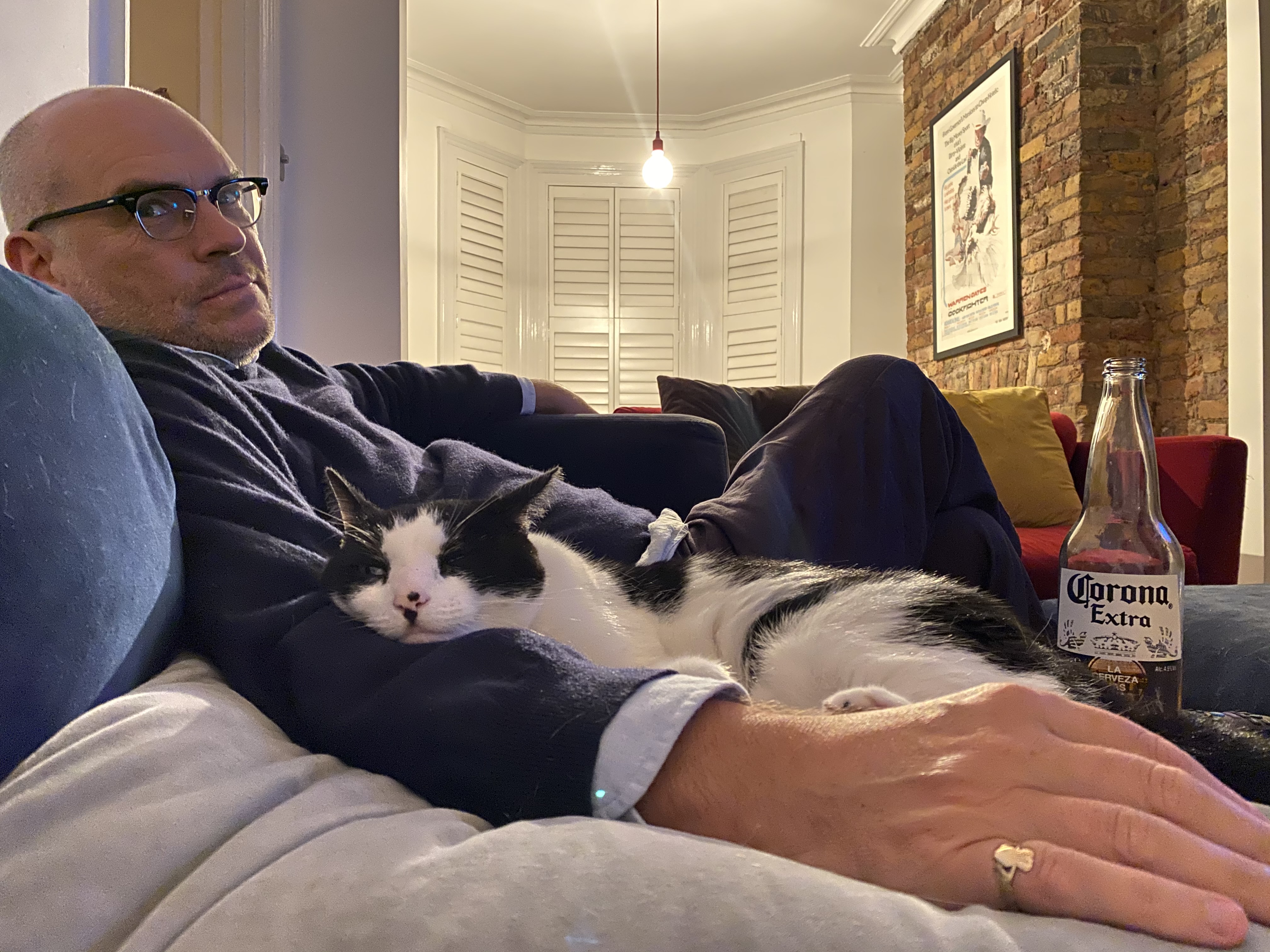 John Michael McDonagh (left) and his cat, Puss. Photo taken by his wife, film producer [[Elizabeth Eves]].