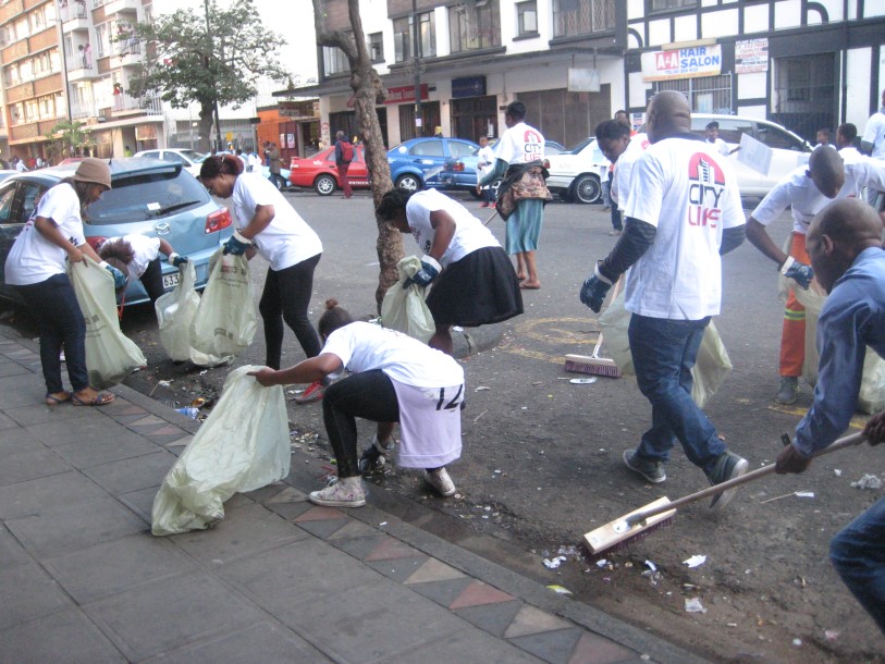 people cleaning the streets