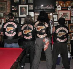 Four Hells Angels members display their jackets' 'colors'.jpg