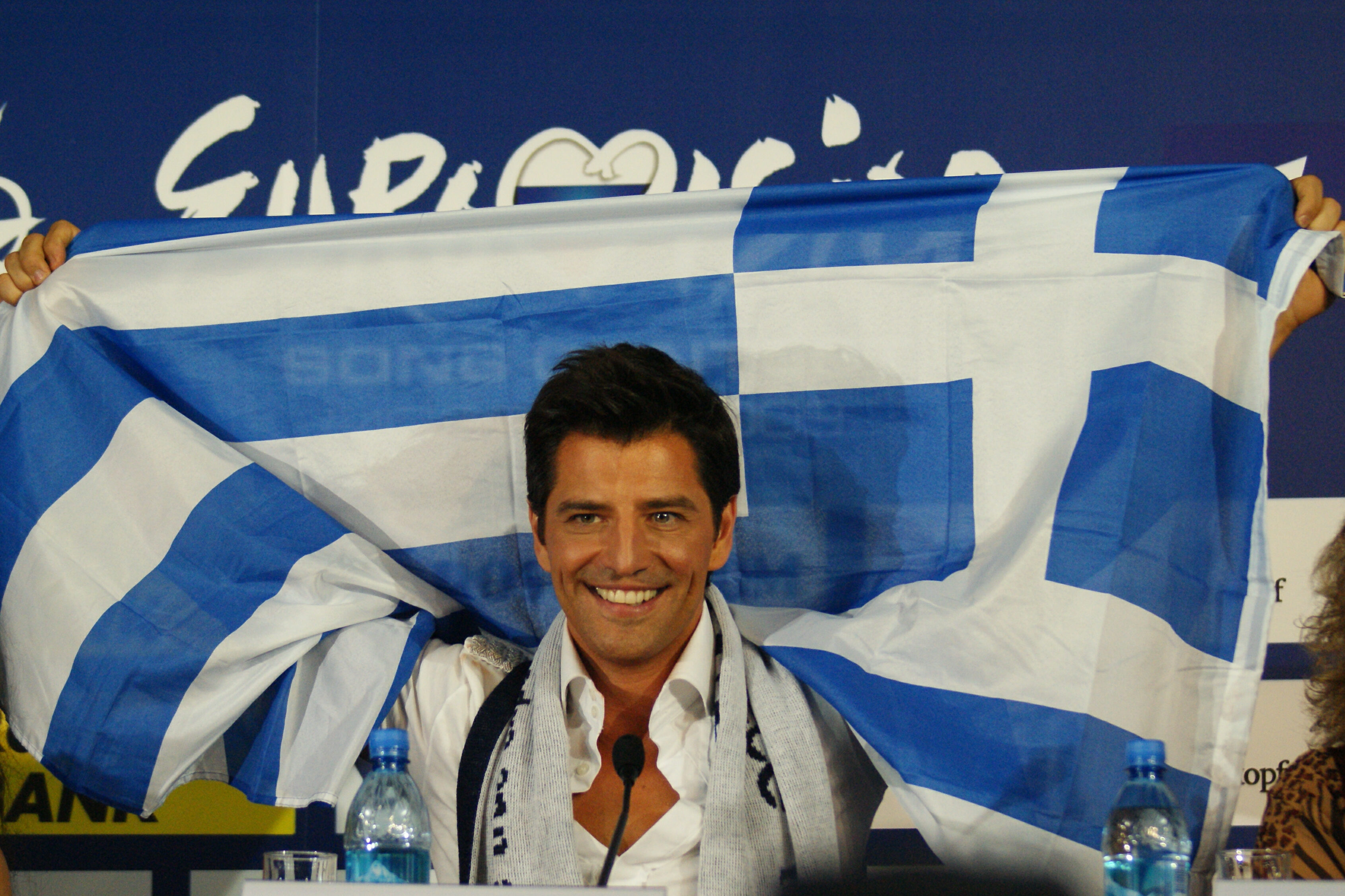 FileSakis Rouvas Raising Greek Flag pic