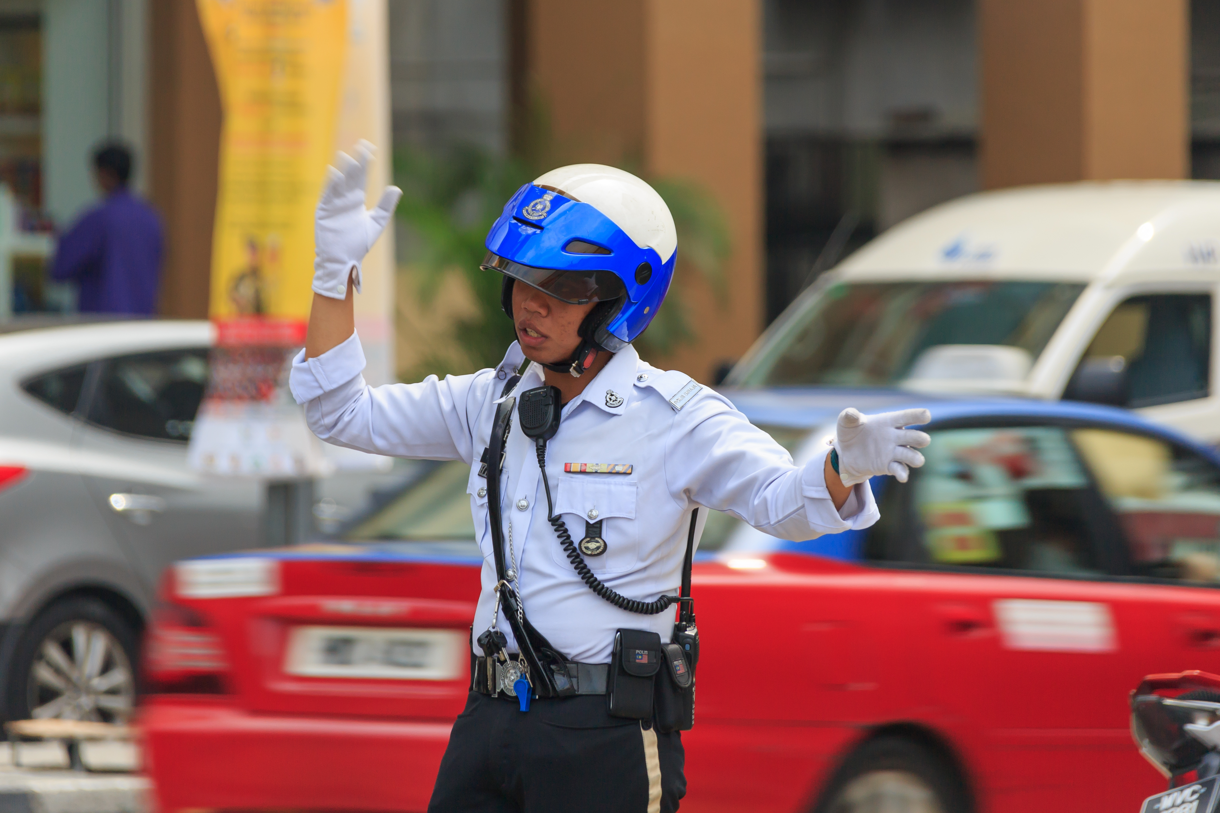 a police officer giving ticket at a intersection