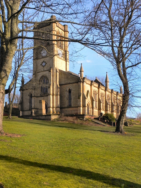 19th century stone church with side aisles and bell gable