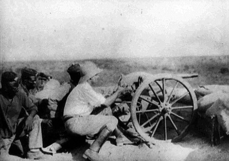 File:German officer fires gun in Garua.jpg