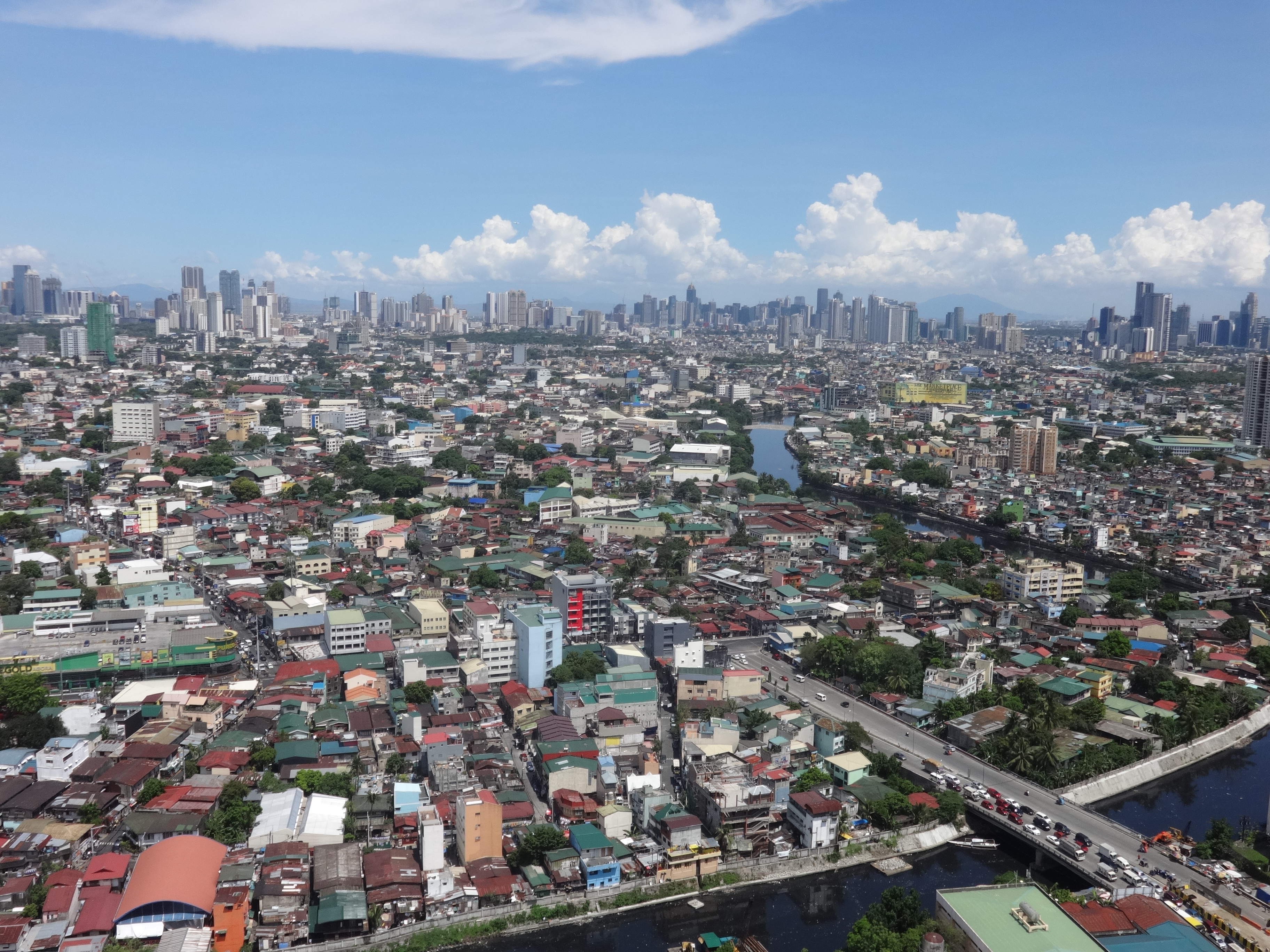 Central Metro Manila area with Ortigas, BGC and Makati skyline - aerial vie...