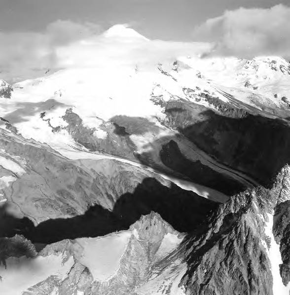 File:Iliamna Volcano, source of valley glaciers with icefall, and bergschrund faintly visible on the upper portions, September 3, 1966 (GLACIERS 6588).jpg