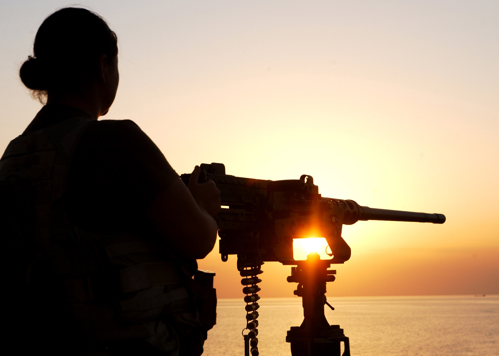 US_Navy_051111-N-9362D-012_A_U.S._Navy_Sailor_mans_a_.50_caliber_machine_gun_mount_on_the_Khawr_Al_Amaya_Oil_Terminal_%28KAAOT%29_during_sunset.jpg