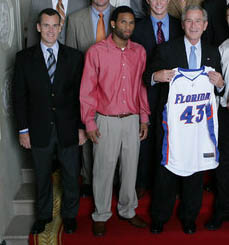 Billy Donovan, left, and the 2006–07 Gators, with U.S. President George W. Bush at the White House in 2007.