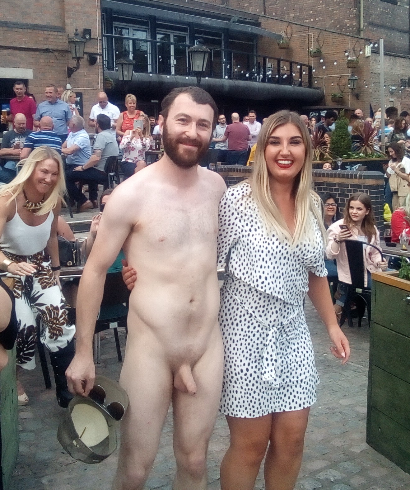 File:Naked male posing with girl in public.jpg - Wikimedia Commons