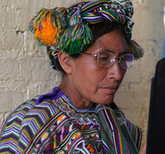 A Guatemalan woman tests a pair of reading glasses at a village campaign. Guatemalanwithglasses.jpg