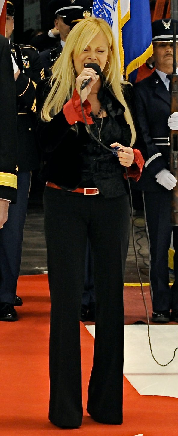 Newman singing "[[The Star-Spangled Banner]]" before a [[Detroit Red Wings]] game at [[Joe Louis Arena]] on November 11, 2010